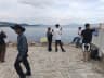 Visitors walking beside the water at Dameisha Seaside Beach Park in Shenzhen