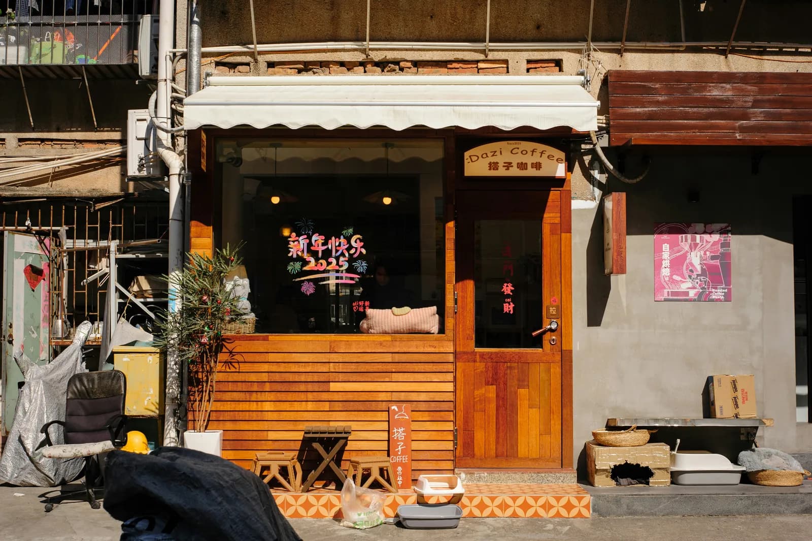 Small coffee shop with a wooden facade on an older Chinese street