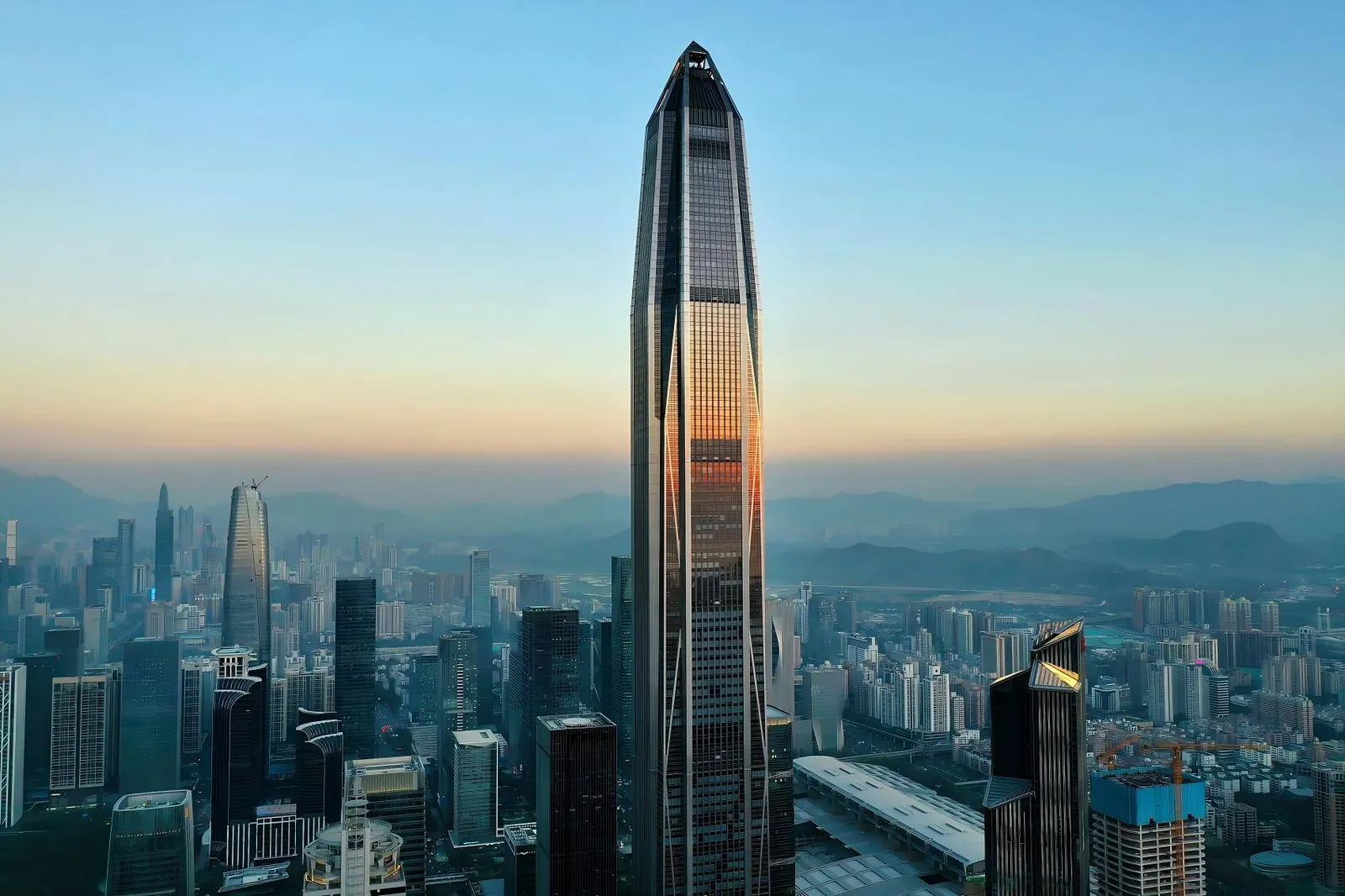Ping An Finance Centre rising above Futian at dusk
