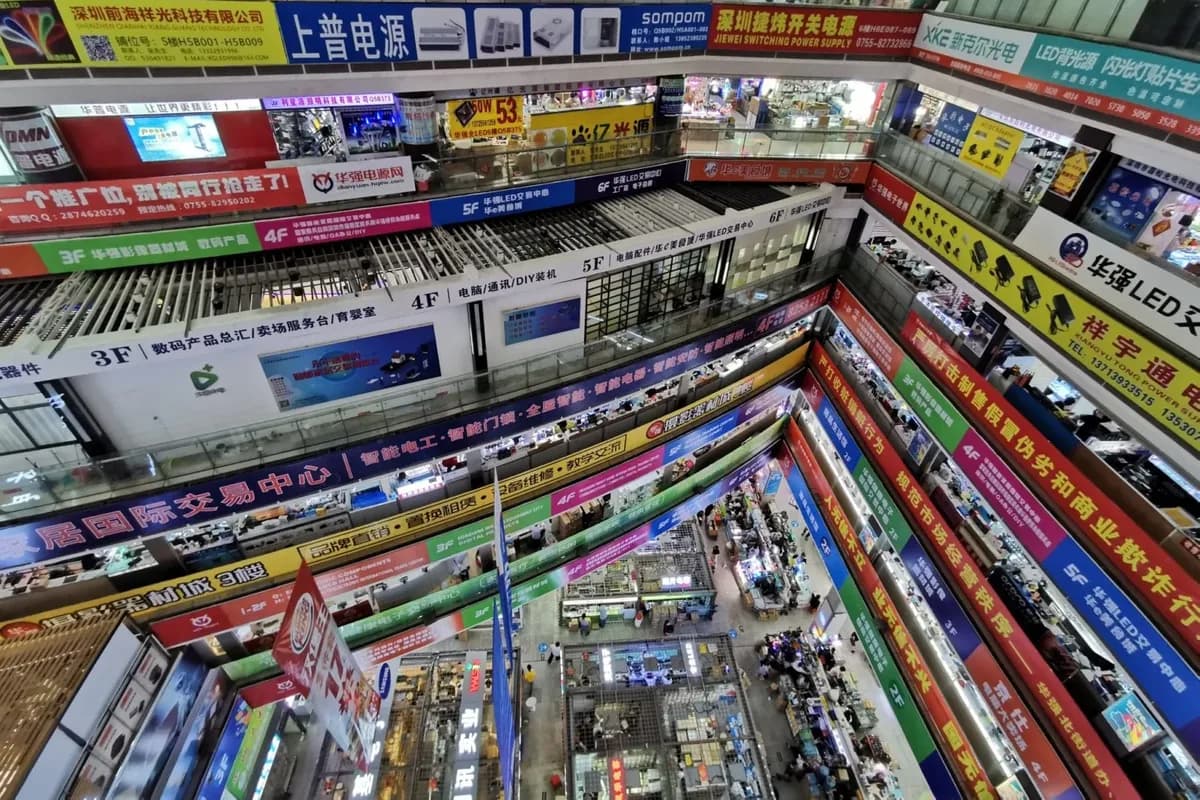 Looking down the atrium of a Huaqiangbei electronics market, floor after floor of shop signs and stalls